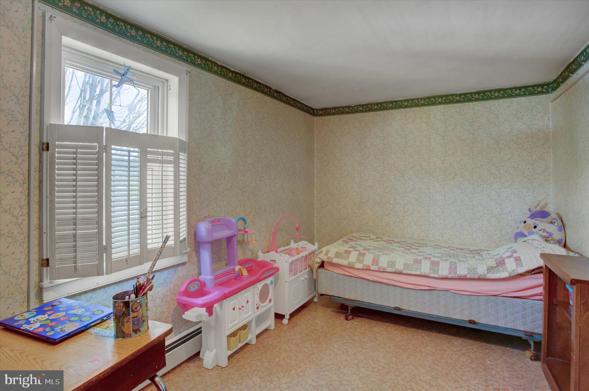 9775 Upper Strasburg Road Upperstrasburg, PA 17265 - Photo 26 of 35 a bedroom with a bed and window