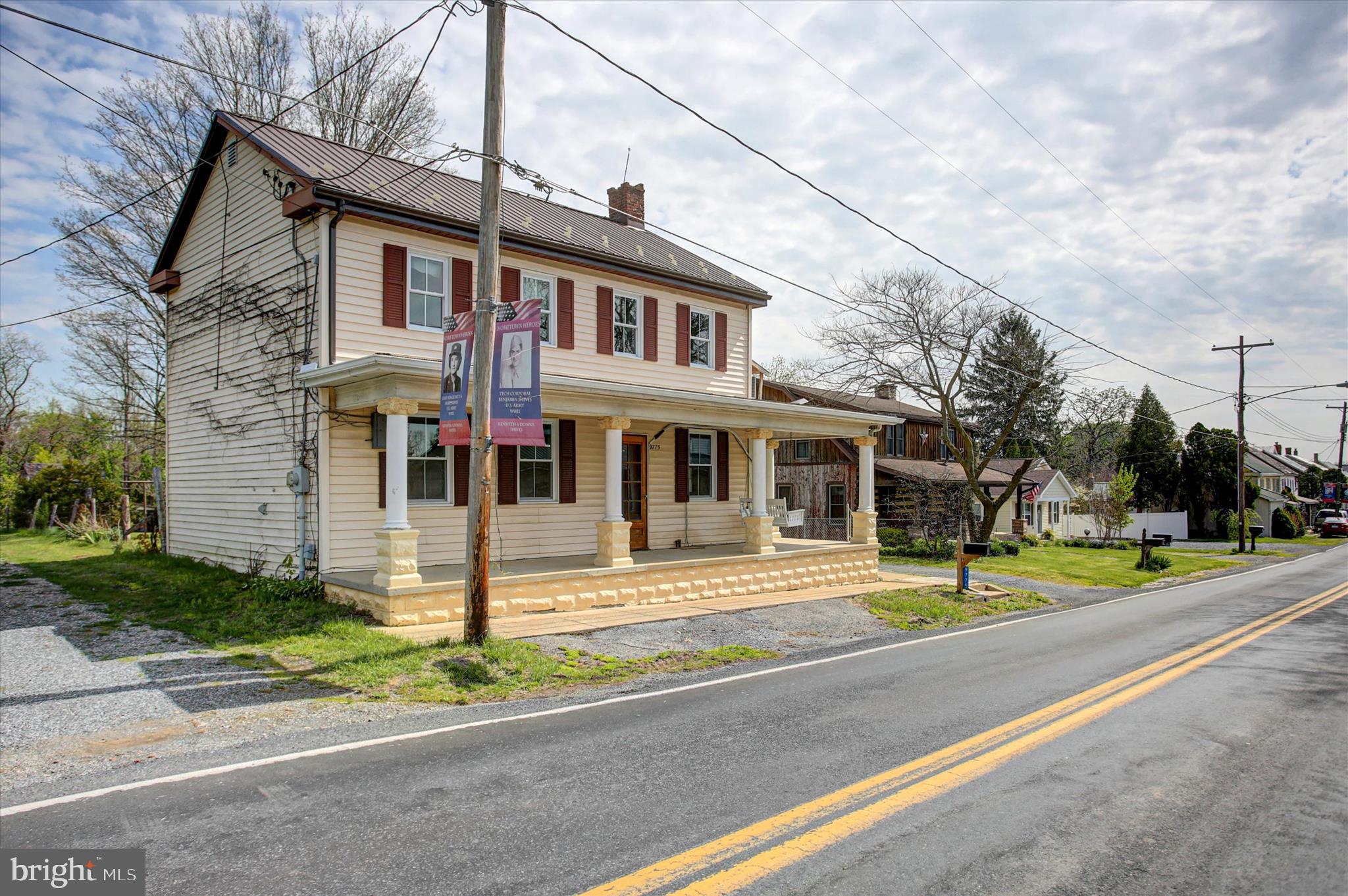 9775 Upper Strasburg Road Upperstrasburg, PA 17265 - Photo 3 of 35 a view of a white house with a small yard and plants