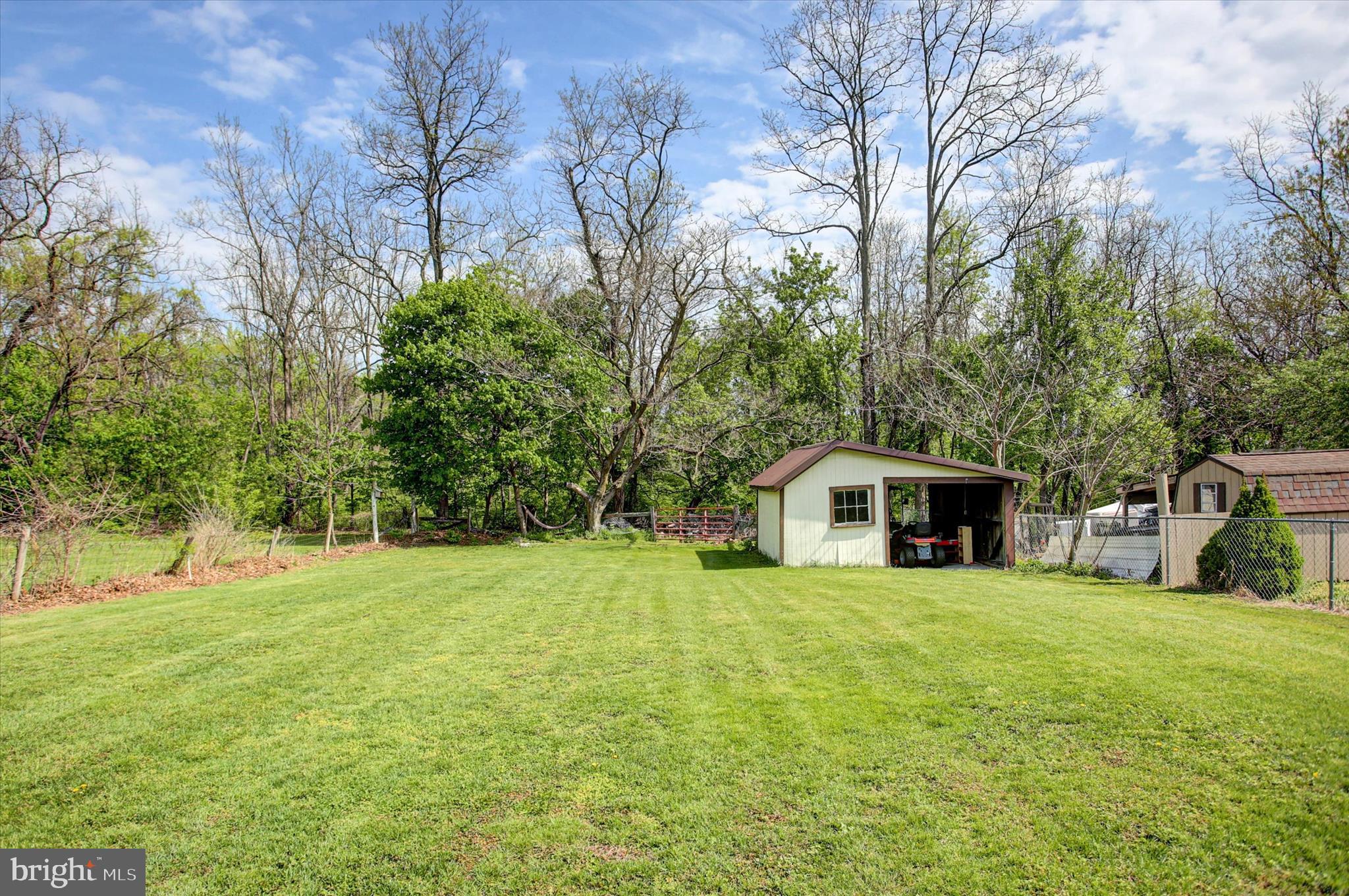 9775 Upper Strasburg Road Upperstrasburg, PA 17265 - Photo 32 of 35 a view of an house with backyard and a tree