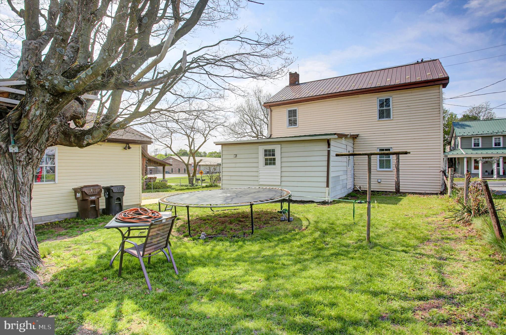 9775 Upper Strasburg Road Upperstrasburg, PA 17265 - Photo 35 of 35 a backyard of a house with table and chairs