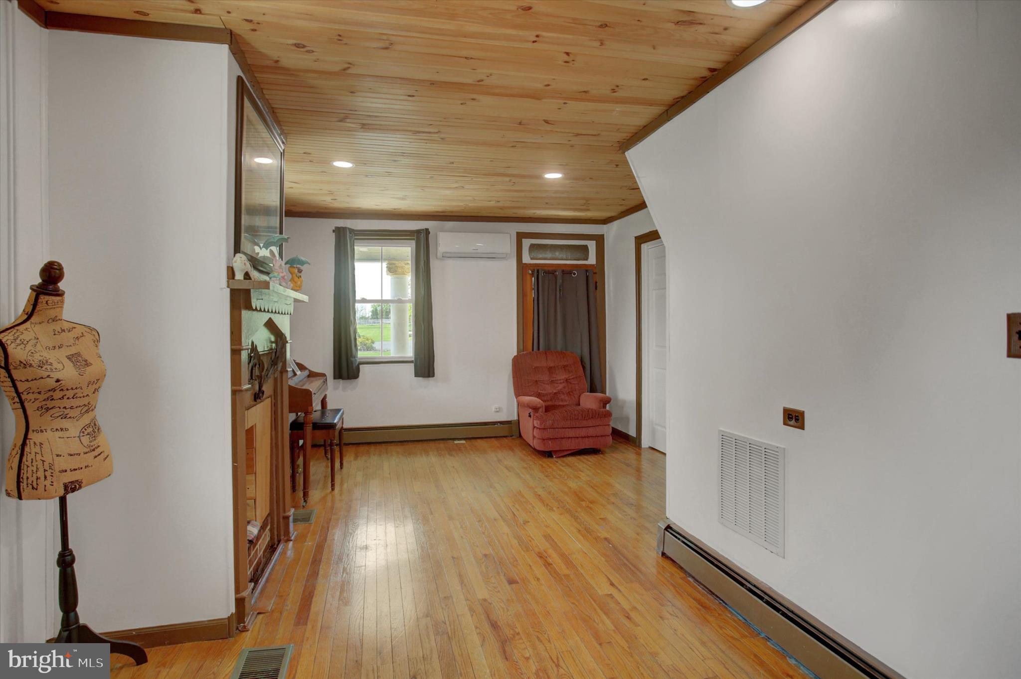 9775 Upper Strasburg Road Upperstrasburg, PA 17265 - Photo 5 of 35 a view of livingroom with furniture and wooden floor