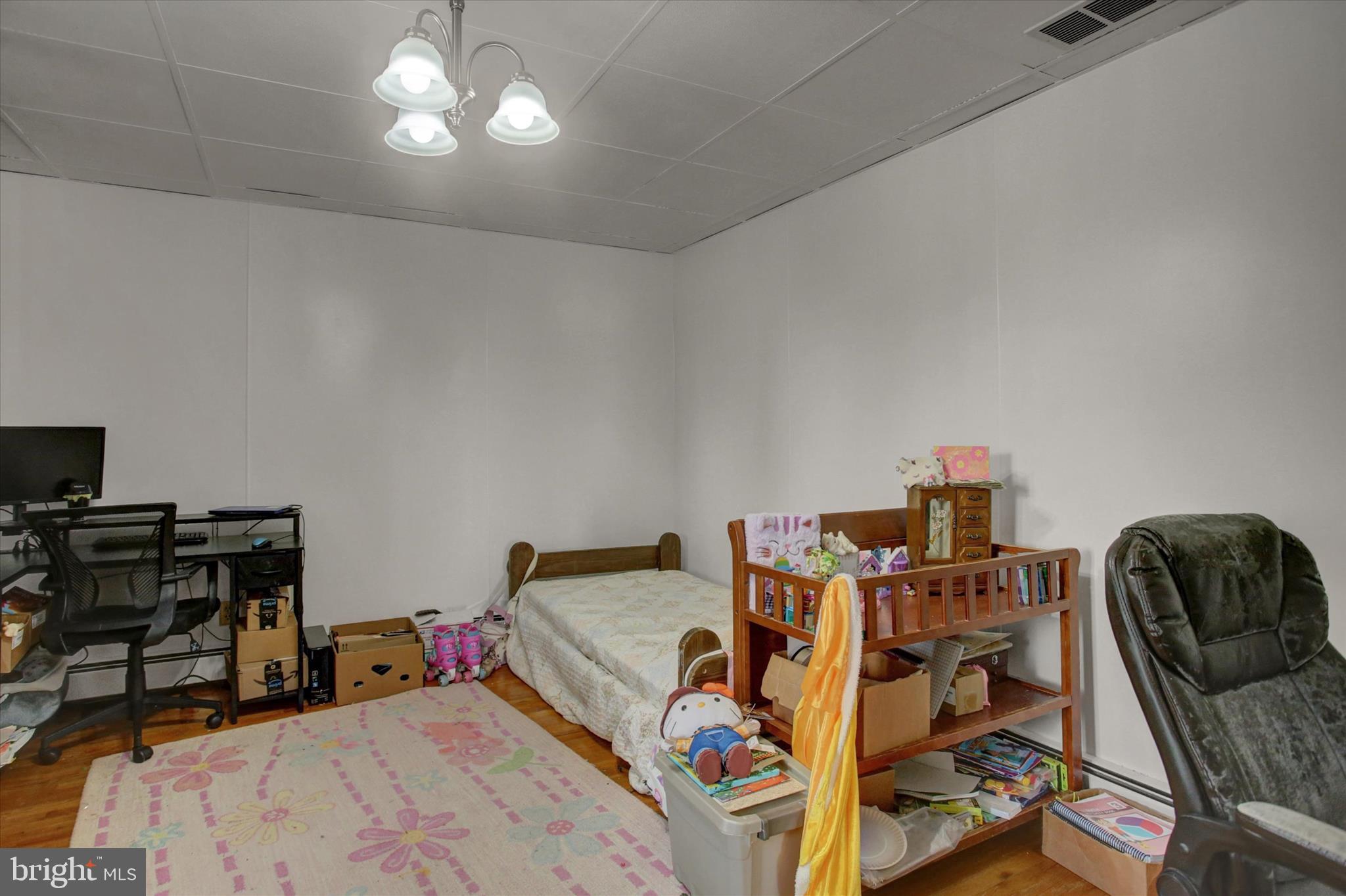 9775 Upper Strasburg Road Upperstrasburg, PA 17265 - Photo 10 of 35 a bed room with a bed and a chair