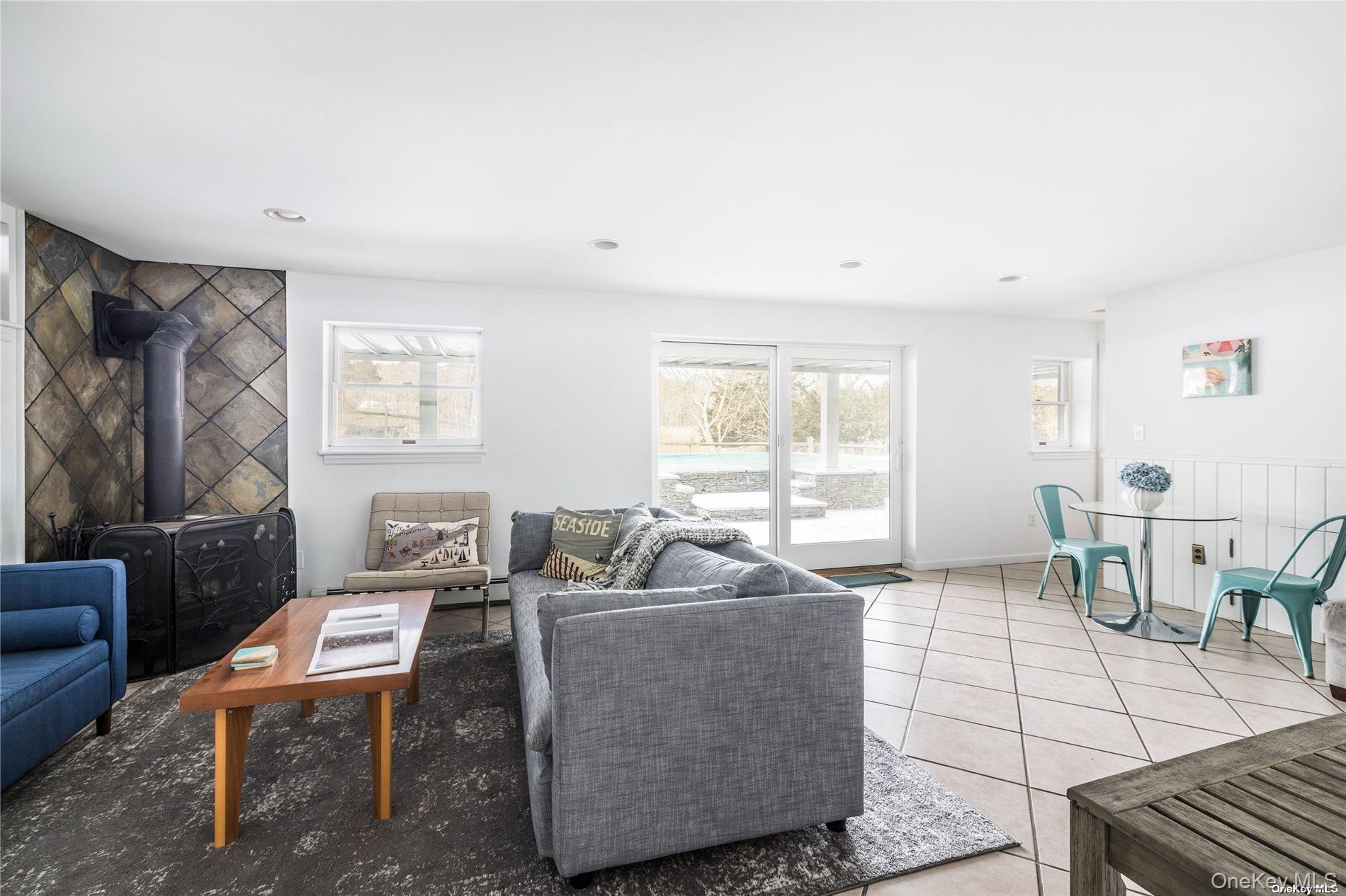 17 B Baycrest Avenue Westhampton, NY 11977 - Photo 17 of 22 a living room with furniture and a window