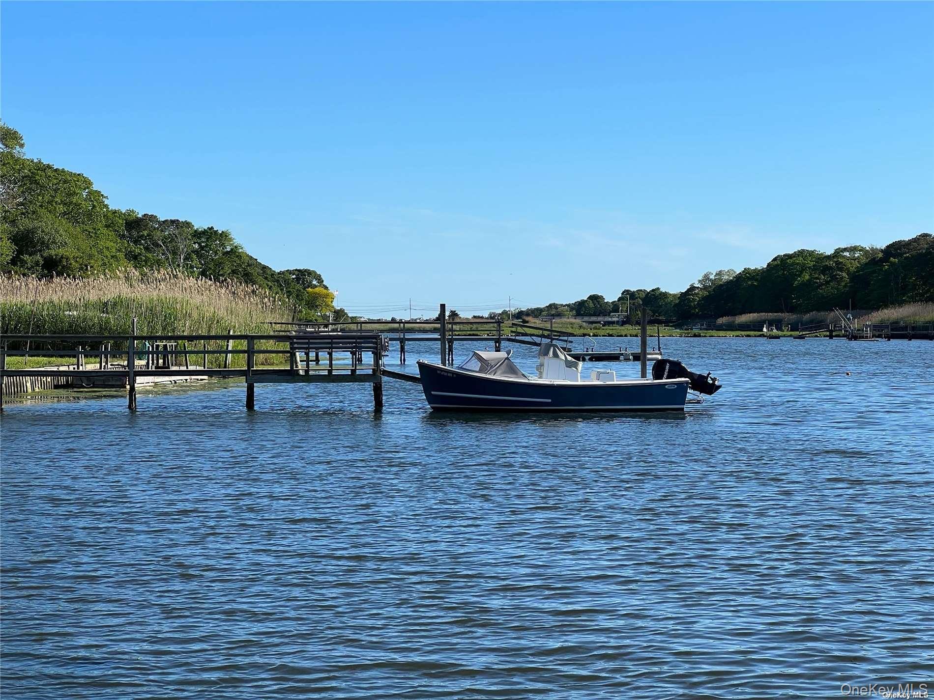 17 B Baycrest Avenue Westhampton, NY 11977 - Photo 21 of 22 a view of a lake with a mountain view