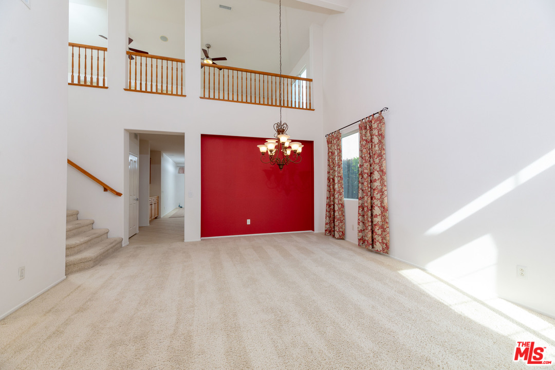 6837 Raspberry Court Eastvale, CA 92880 - Photo 5 of 41 a view of a livingroom with a flat screen tv