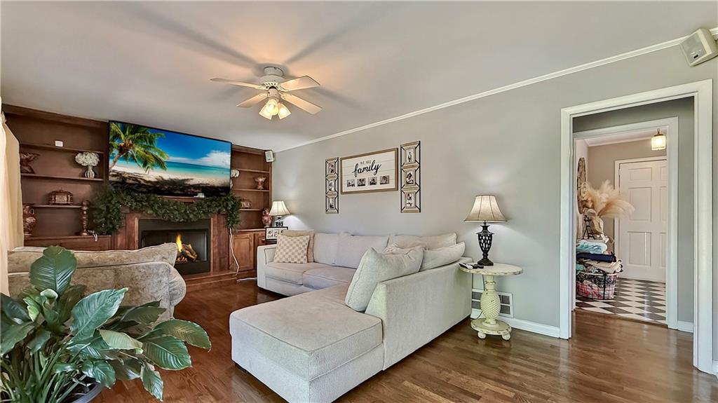 120 Valley Circle Calhoun, GA 30701 - Photo 19 of 39 a living room with furniture a flat screen tv and a fireplace