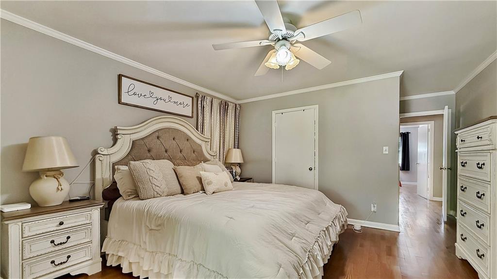 120 Valley Circle Calhoun, GA 30701 - Photo 27 of 39 a bedroom with a bed and wooden floor