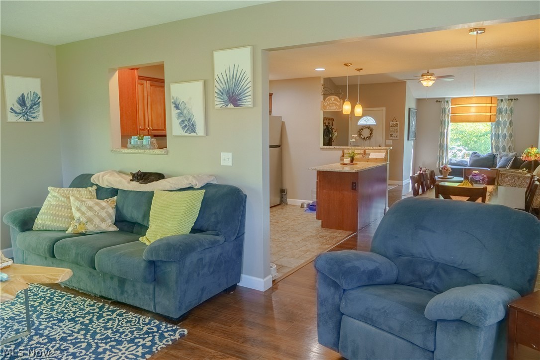1362 Apollo Court Rome, OH 44085 - Photo 16 of 32 Living room featuring ceiling fan and hardwood / wood-style flooring