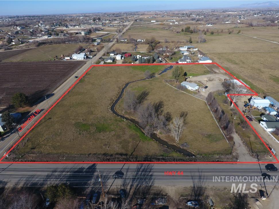 13648 Highway 44 Caldwell, ID 83607 - Photo 2 of 8 Aerial view of sparsely populated area with property boundaries highlighted