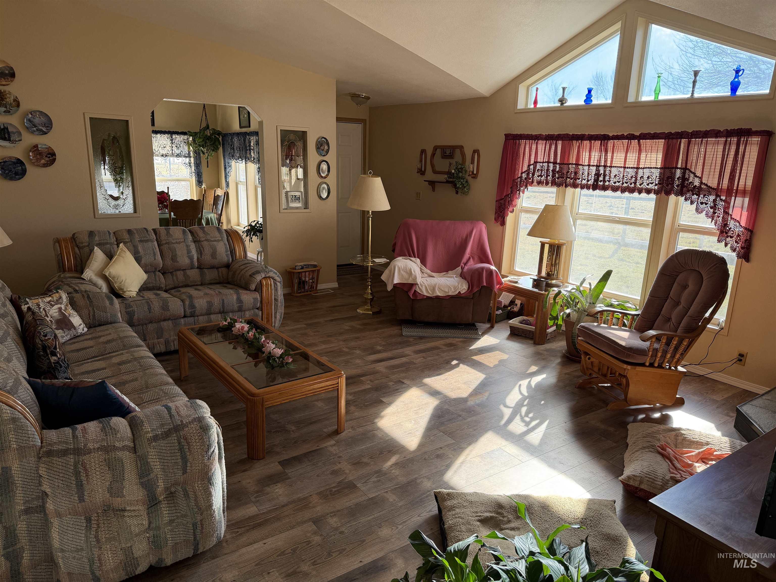 13648 Highway 44 Caldwell, ID 83607 - Photo 7 of 8 Living room featuring lofted ceiling and wood finished floors