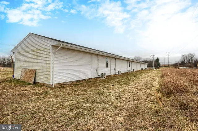 a backyard of a house with wooden fence