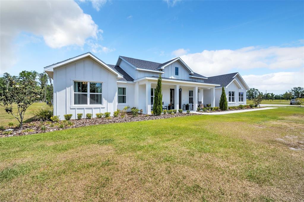 a front view of house with yard and green space