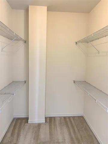 a view of an empty walk in closet