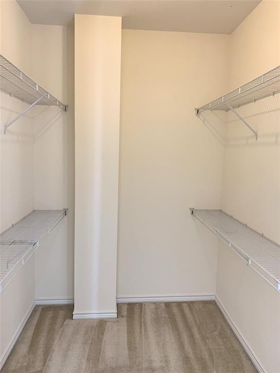 2106 Azure Pointe Richardson, TX 75080 - Photo 16 of 20 a view of an empty walk in closet