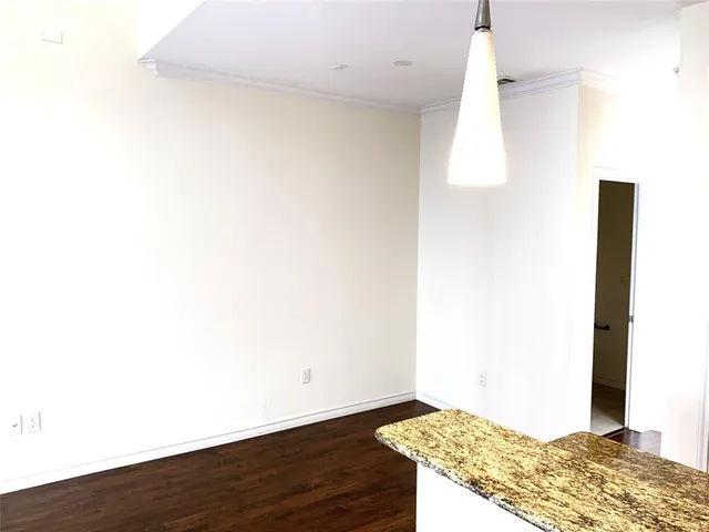 a view of kitchen with wooden floor