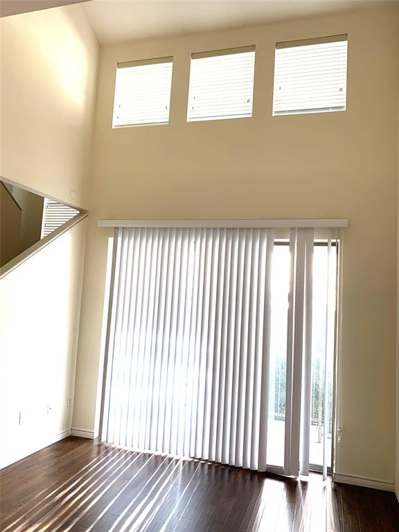 2106 Azure Pointe Richardson, TX 75080 - Photo 9 of 20 an empty room with wooden floor and windows