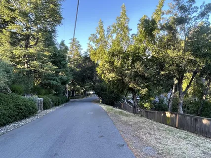 a view of balcony with wooden fence