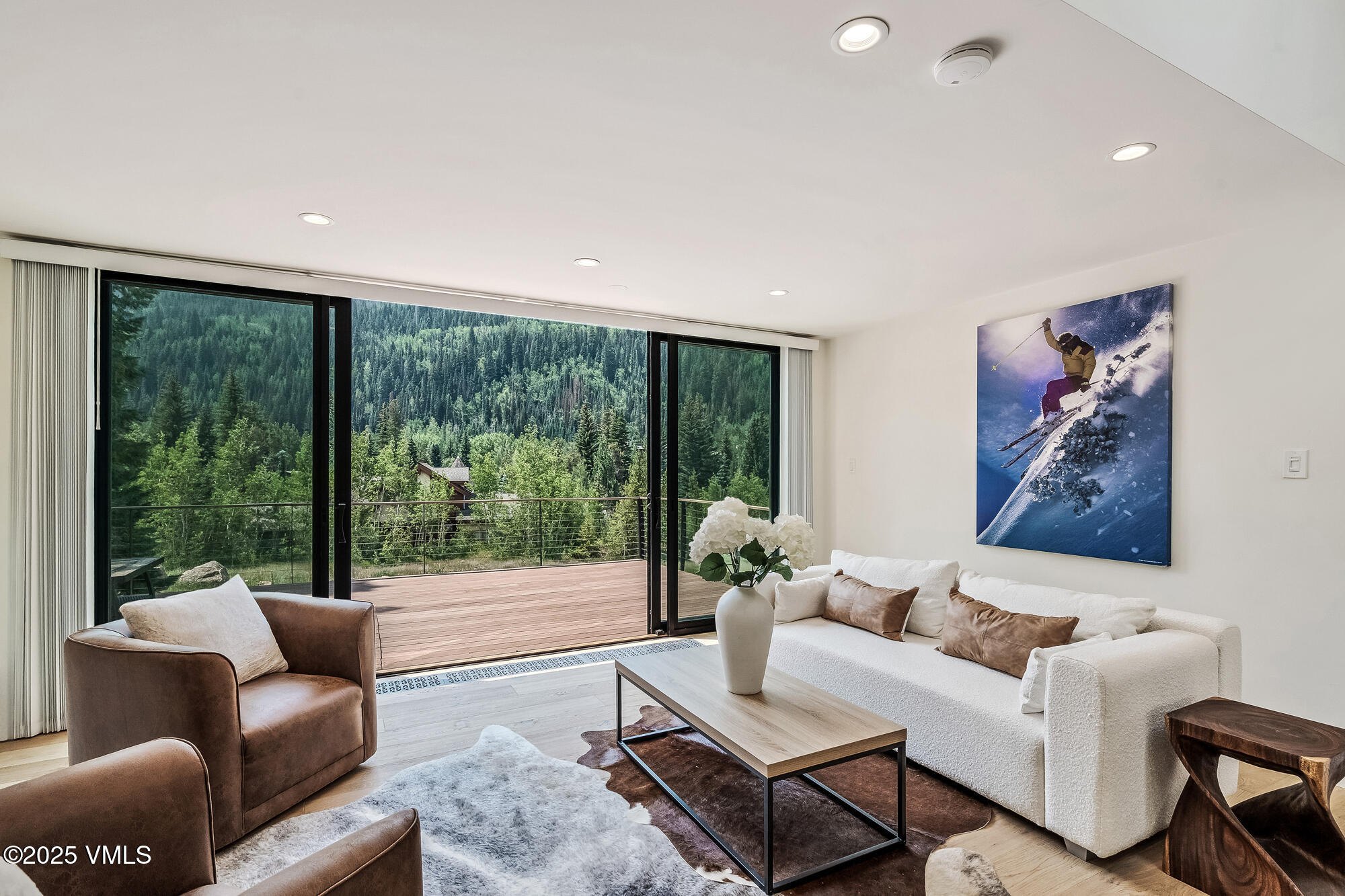 4545 Big Horn Road Vail, CO 81657 - Photo 1 of 49 a living room with furniture and a large window