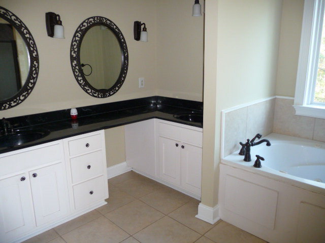 680 Jenkins Road Forsyth, GA 31029 - Photo 12 of 15 a bathroom with a sink and a mirror