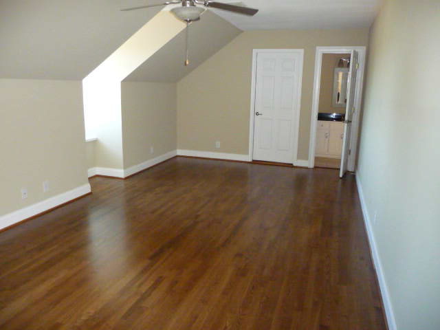 680 Jenkins Road Forsyth, GA 31029 - Photo 13 of 15 an empty room with wooden floor and windows
