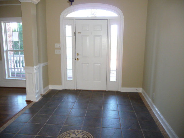680 Jenkins Road Forsyth, GA 31029 - Photo 3 of 15 an empty room with wooden floor and a window