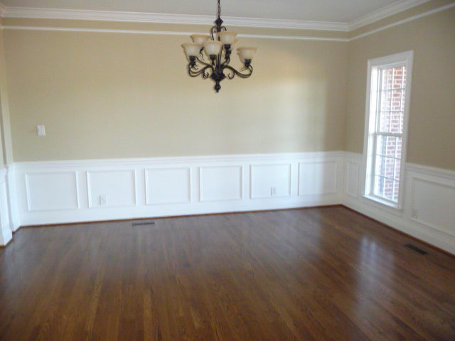 680 Jenkins Road Forsyth, GA 31029 - Photo 4 of 15 a view of an empty room with wooden floor and a window