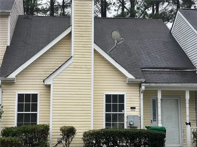 a front view of a house with a garage