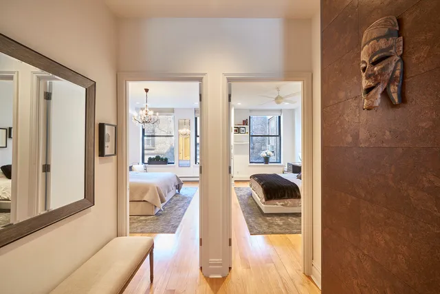 a bathroom with a shower sink vanity and mirror