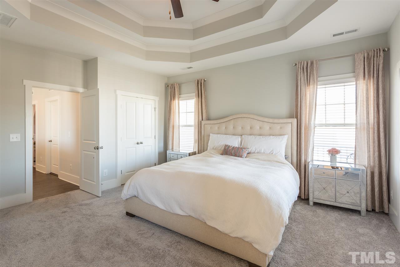 5410 Beckom Street Raleigh, NC 27616 - Photo 11 of 30 Custom tray ceiling with crown molding.... Ceilings fans in ALL bedrooms, family room, bonus room and screened in porch!