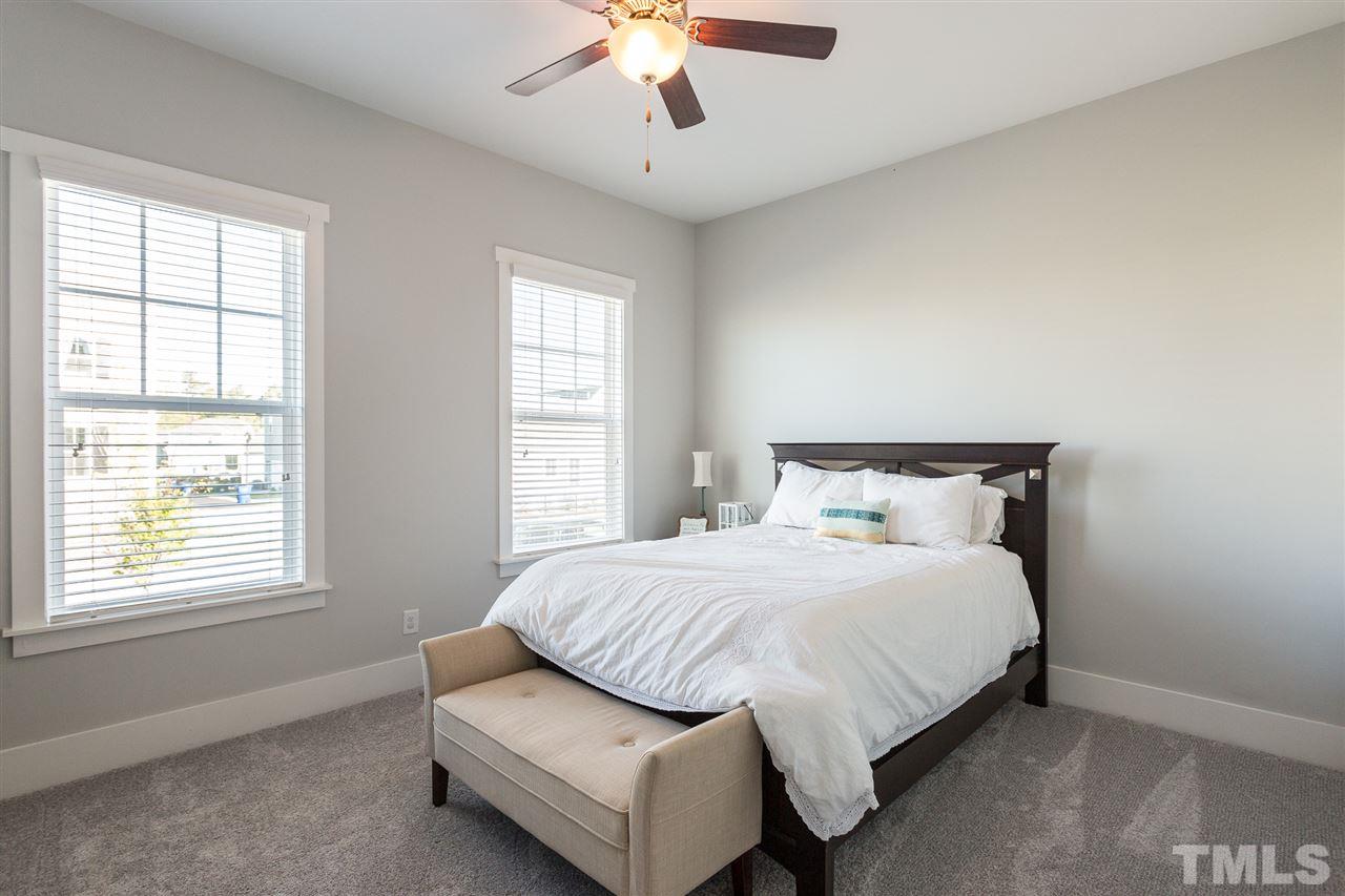 5410 Beckom Street Raleigh, NC 27616 - Photo 15 of 30 1st Floor Bedroom has large walk in closet and a FULL bathroom.