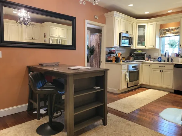a kitchen with a sink cabinets and appliances