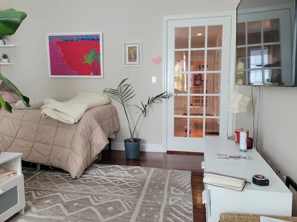 a living room with a couch and a window