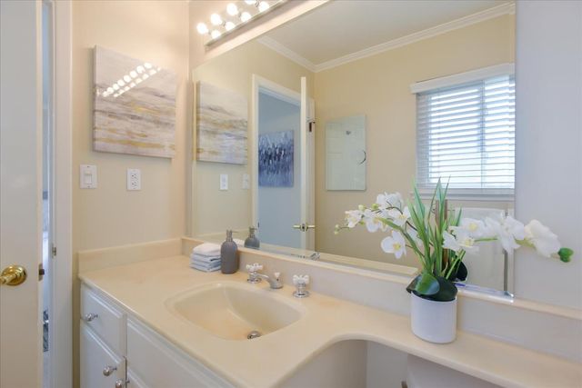 a view of backyard with a large pool and outdoor seating