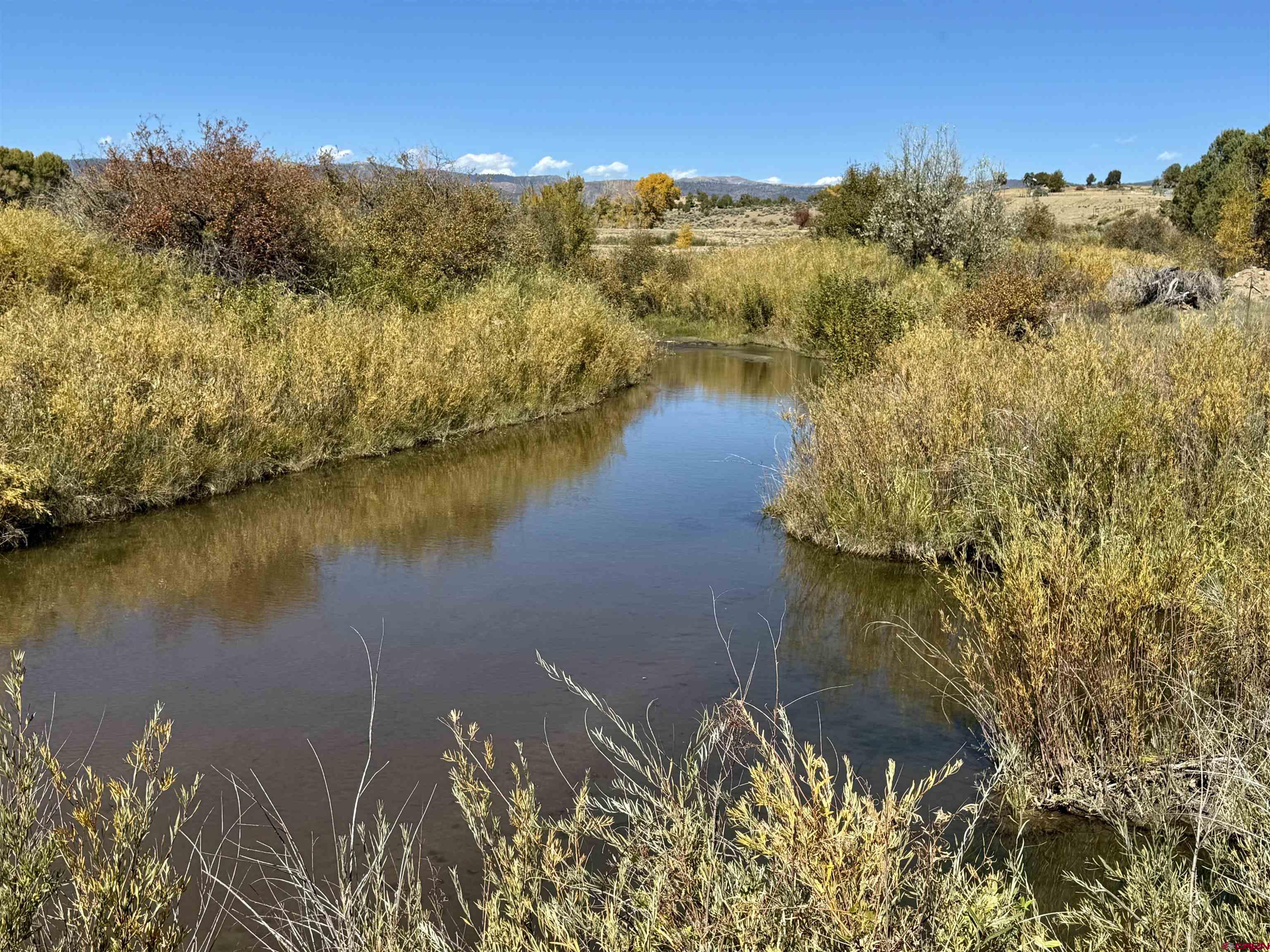 769-784 Bareback Lane Durango, CO 81303 - Photo 15 of 21 a view of a lake with a mountain in the background