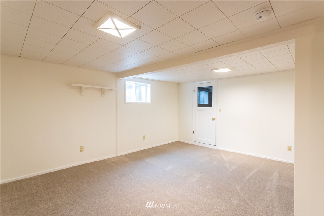 879 East Wiser Lake Road Lynden, WA 98264 - Photo 26 of 36 an empty room with a empty space and windows