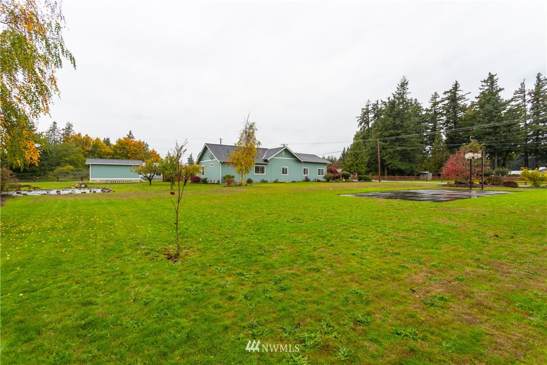 879 East Wiser Lake Road Lynden, WA 98264 - Photo 29 of 36 a view of a golf course with a lake view