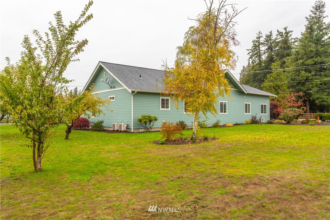 879 East Wiser Lake Road Lynden, WA 98264 - Photo 30 of 36 a front view of house with yard and trees