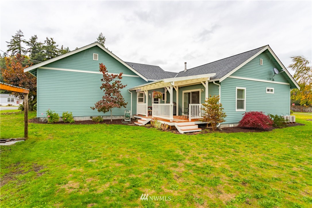 879 East Wiser Lake Road Lynden, WA 98264 - Photo 31 of 36 a view of a house with backyard porch and garden