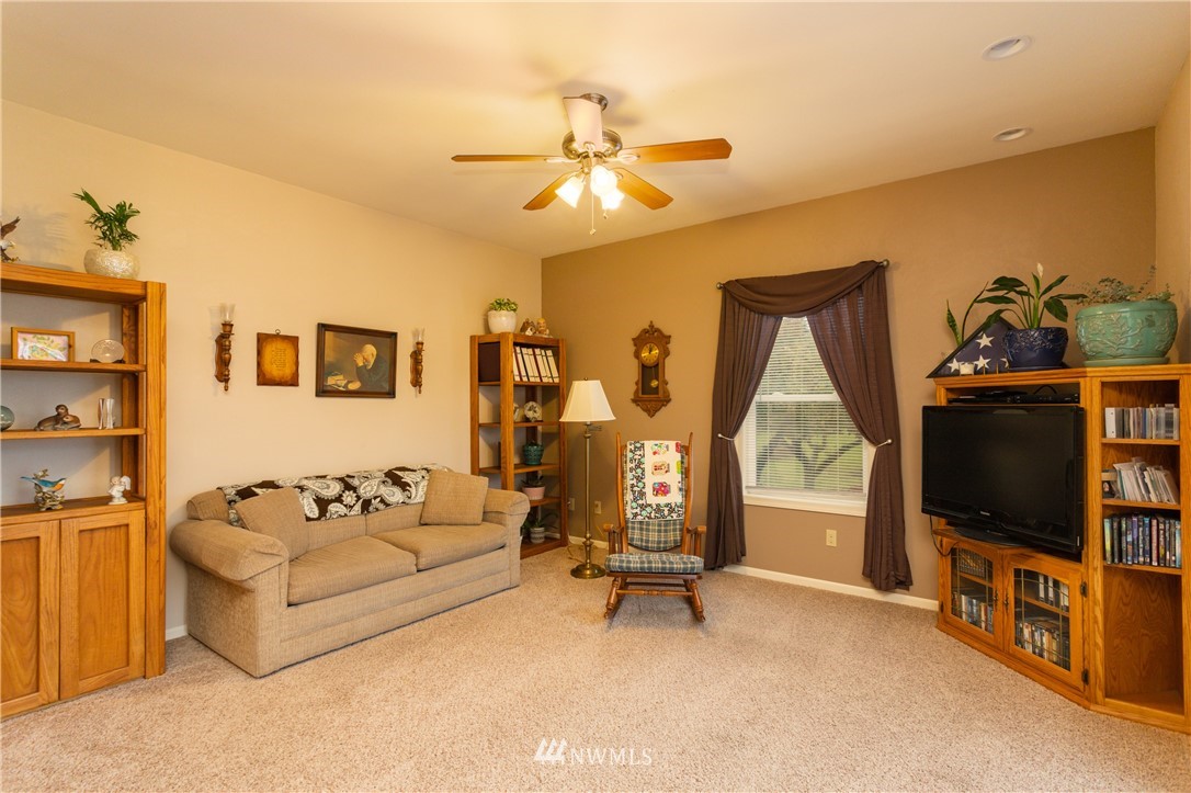 879 East Wiser Lake Road Lynden, WA 98264 - Photo 9 of 36 a living room with furniture and a flat screen tv