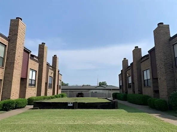 a front view of a building with garden