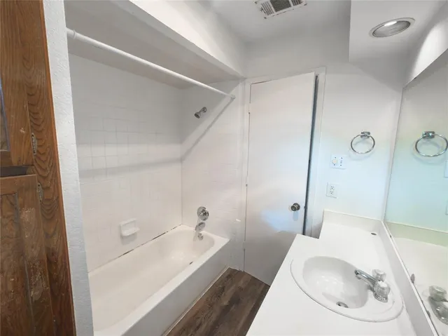 a bathroom with a sink and toilet