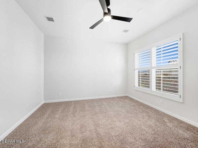 7248 Cimarron Rim Drive El Paso, TX 79911 - Photo 13 of 48 a view of an empty room with a window