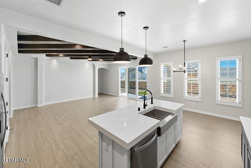 7248 Cimarron Rim Drive El Paso, TX 79911 - Photo 19 of 48 a kitchen with a sink a counter space and windows