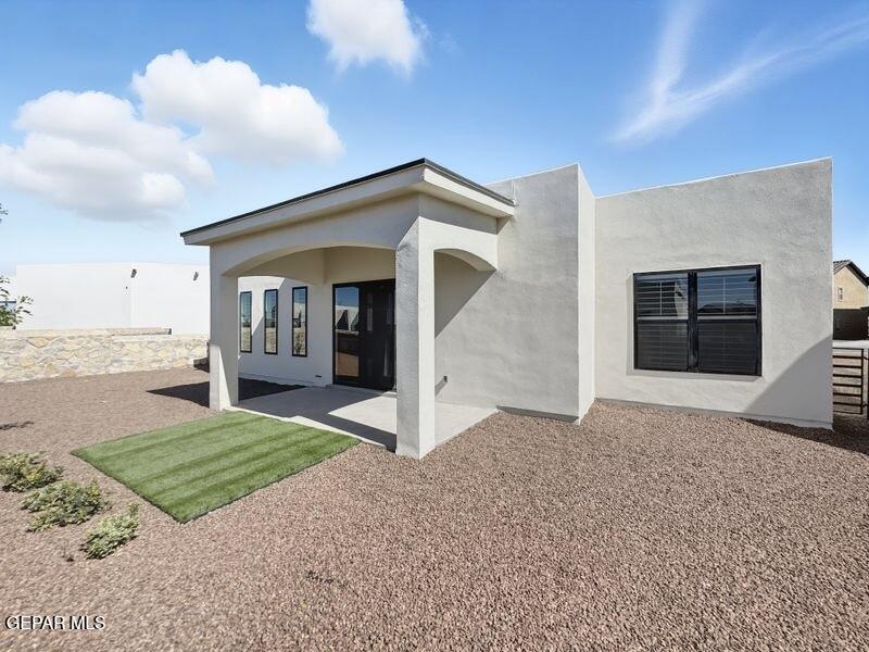 7248 Cimarron Rim Drive El Paso, TX 79911 - Photo 2 of 48 a view of a house with a yard and garage