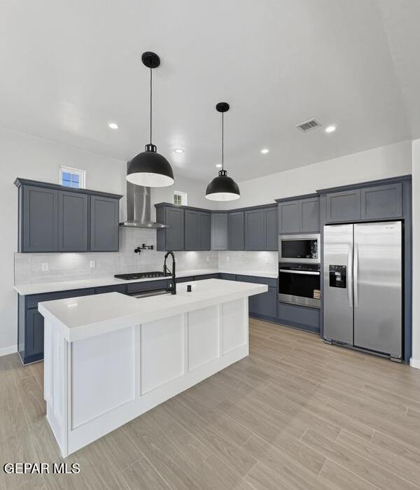 7248 Cimarron Rim Drive El Paso, TX 79911 - Photo 28 of 48 a large kitchen with stainless steel appliances a large counter top a stove a sink and a refrigerator