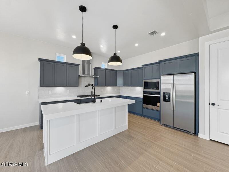 7248 Cimarron Rim Drive El Paso, TX 79911 - Photo 29 of 48 a kitchen with stainless steel appliances a sink and a refrigerator