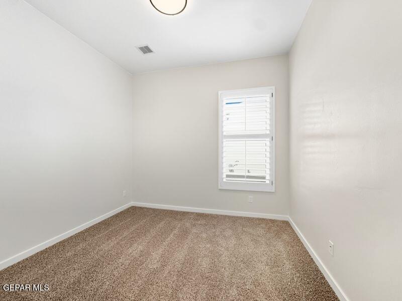 7248 Cimarron Rim Drive El Paso, TX 79911 - Photo 34 of 48 an empty room with a window