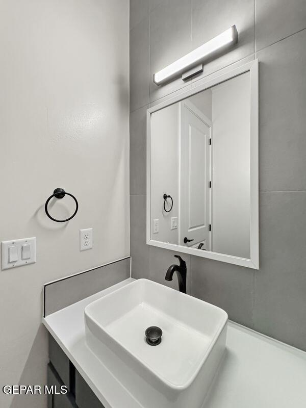 7248 Cimarron Rim Drive El Paso, TX 79911 - Photo 35 of 48 a bathroom with a sink and a mirror