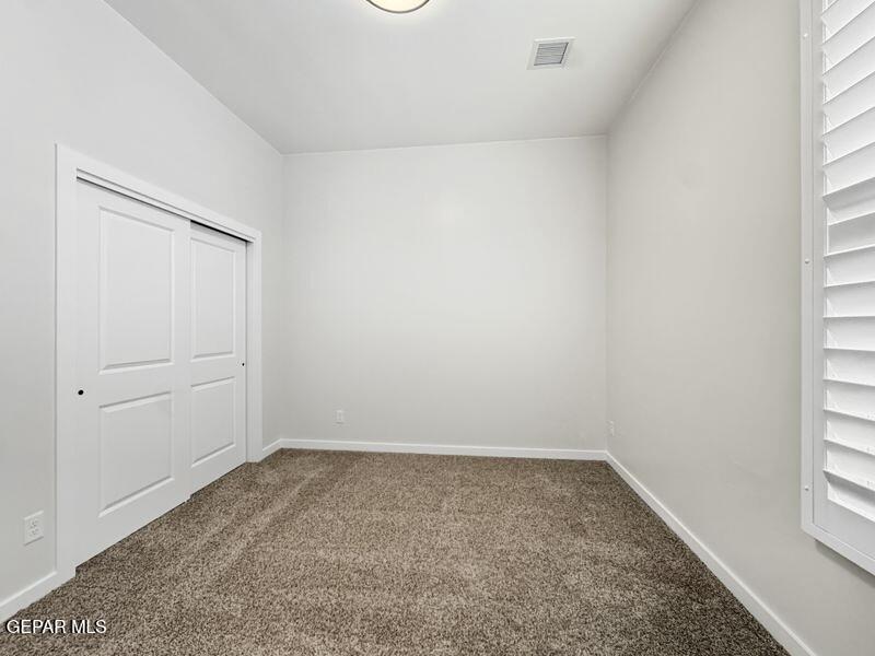 7248 Cimarron Rim Drive El Paso, TX 79911 - Photo 40 of 48 an empty room with windows