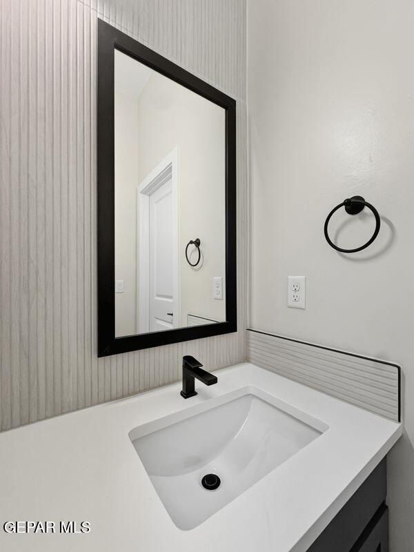 7248 Cimarron Rim Drive El Paso, TX 79911 - Photo 41 of 48 a bathroom with a sink and a mirror